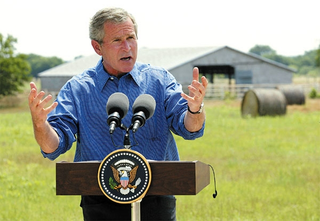 Bush addresses the press during his vacation.